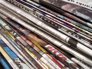 A pile of folded newspapers