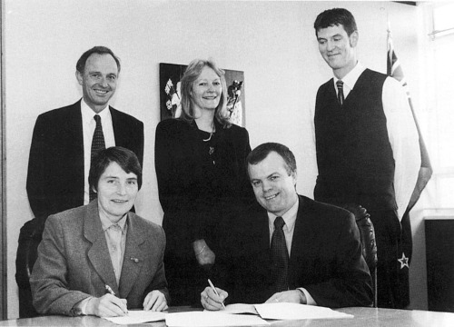 Thomson Reuters NZ staff sign an agreement to supply the Courts
